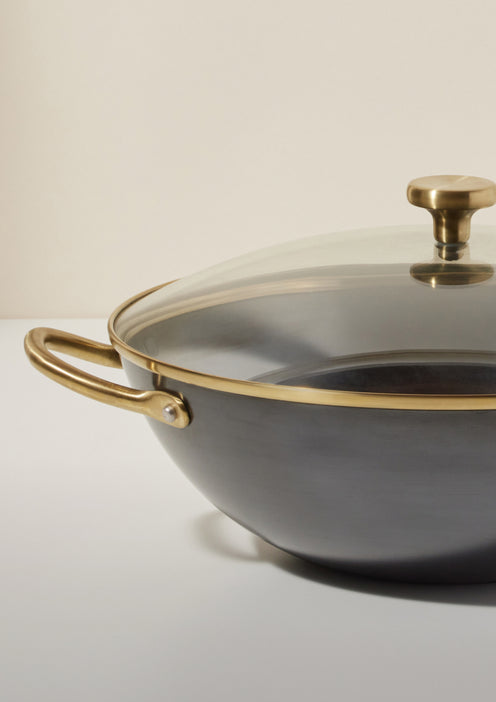 black hot work with clear and gold rimmed glass lid