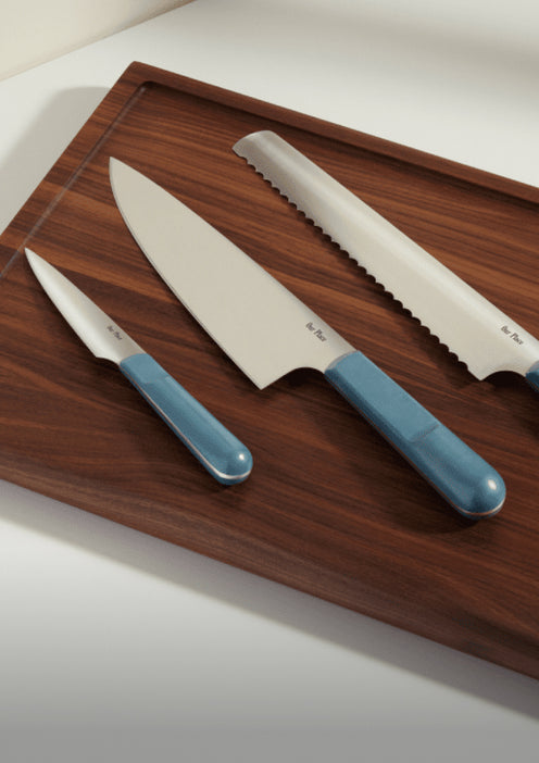 blue salt knife trio on cutting board
