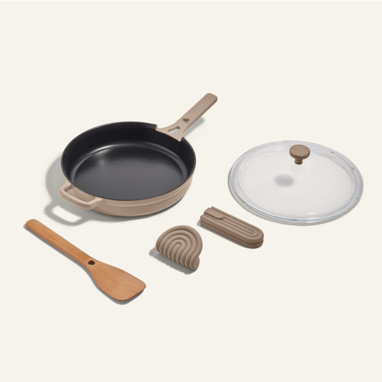 Beige Cast Iron Always Pan with spatula and hot grips