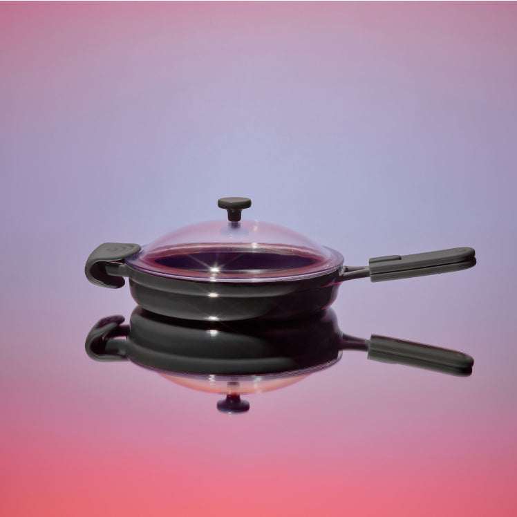 Black Cast Iron Always Pan with reflective background