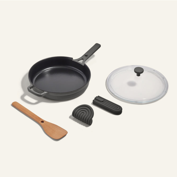 Black Cast Iron Always Pan with spatula and hot grips