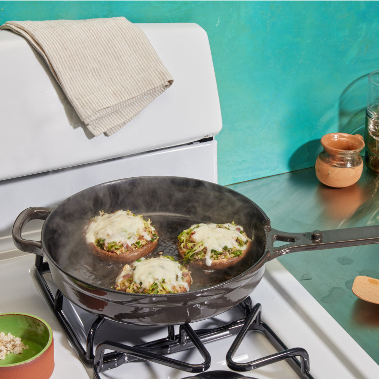Black Cast Iron Always pan on stovetop cooking portobello