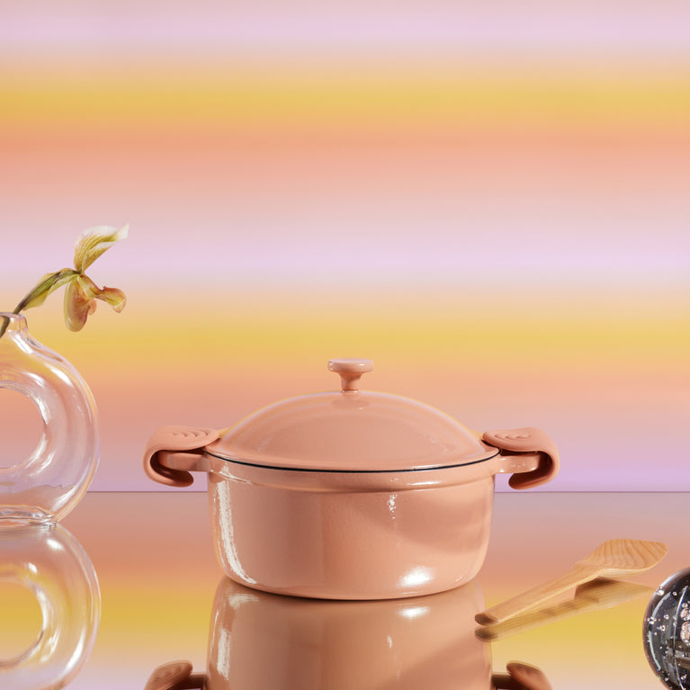 Pink Cast Iron Perfect Pot with hot grips and scraper with pink background