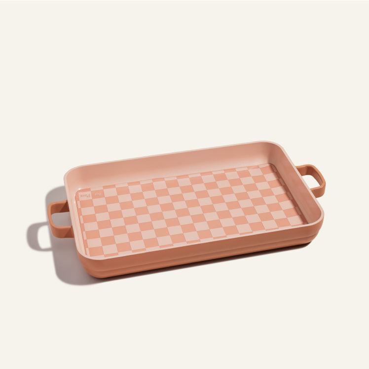 Pink griddle pan with oven mat