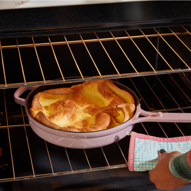 Purple Cast Iron Always Pan in oven with dutch baby