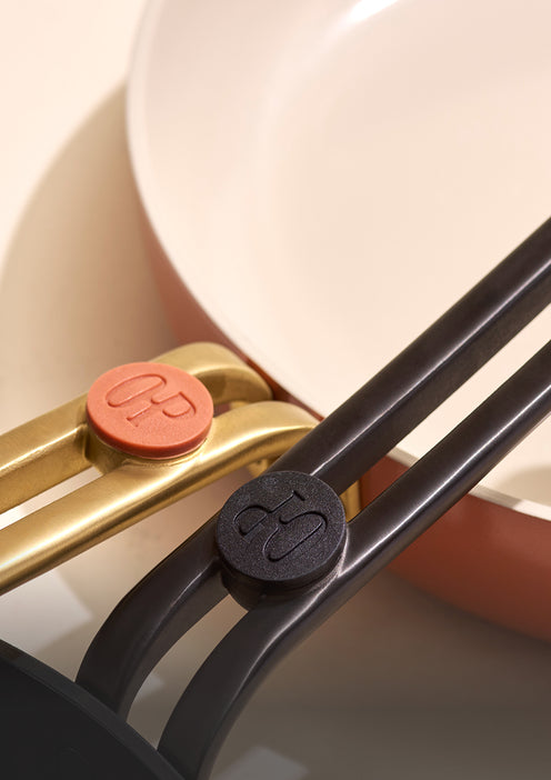 Close-up of a kitchen utensil with a brand logo on a neutral background