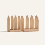 Three storage system holders on a light beige background