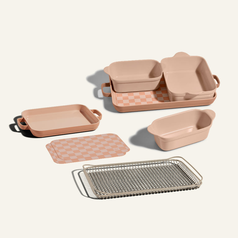 pink bakeware set, and mini griddle pan. Beige oven rack