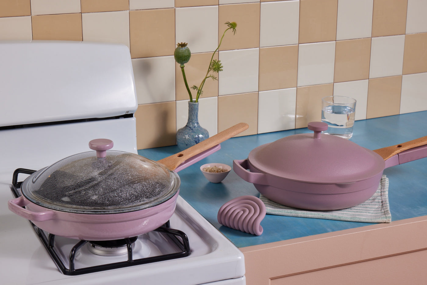Lavender cast iron and ceramic Always Pans on a stovetop