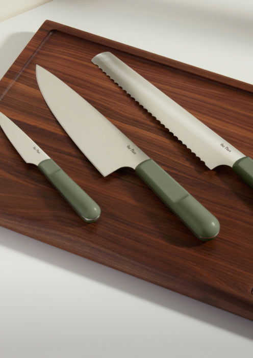 sage knife trio on cutting board