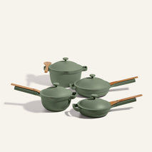 The Cookware Set features four green pots and pans with wooden handles and matching lids, displayed on a neutral background.