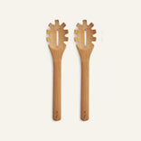 Two identical Beechwood Serving Spoons with slotted, notched heads are placed side by side on a plain light background.