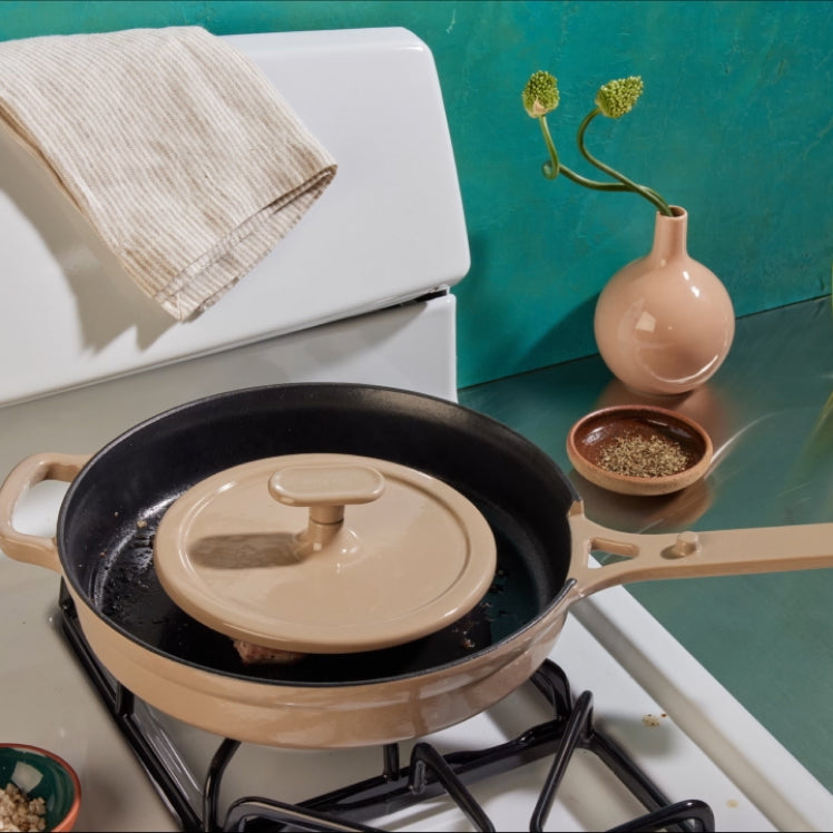 Beige Grill Press used on a steak in a beige Cast Iron Always Pan