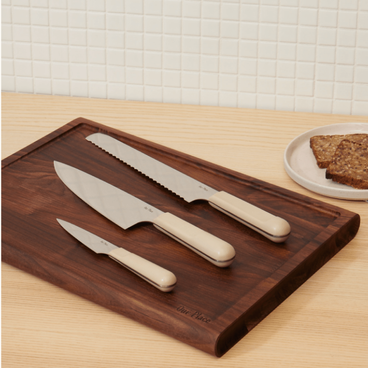 Beige Knife Trio on top of the Walnut Cutting Board