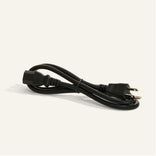 A coiled black power cord with a two-prong plug on one end and a female connector on the other, placed on a plain light background.