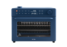 Blue Our Place countertop oven with a digital display and glass door.