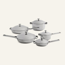 The Titanium Pro Cookware Set+ includes five upgraded stainless steel pieces—pots, pans, and lids—displayed on a neutral background.
