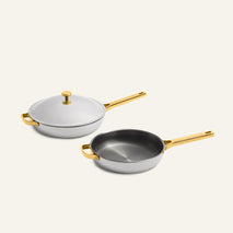 Titanium Pro Always Pan Duo 2.0 set including two light gray non-toxic frying pans with gold-colored handles and one matching lid.