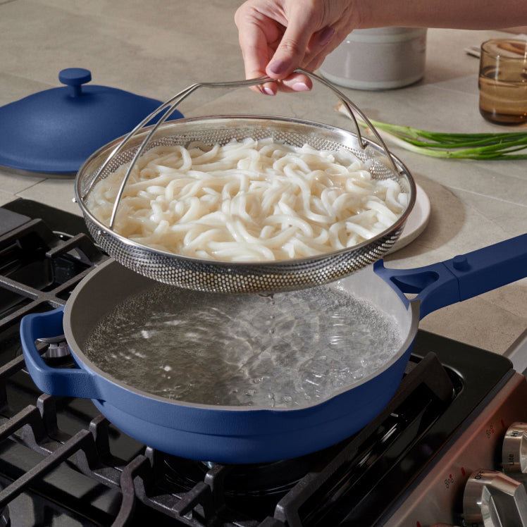 indigo-always-pan-on-stovetop-with-noddles