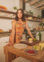 Woman leaning over a mise en place