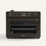 Black oven with digital display on a white background