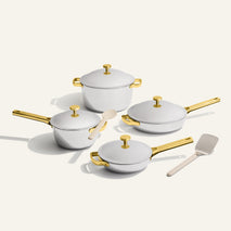 gold titanium perfect pot pro, mini perfect pot pro, always pan pro, and mini always pan pro with silicone spoon and stainless steel spatula