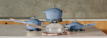 Blue cookware set with titanium always pan pro on counter