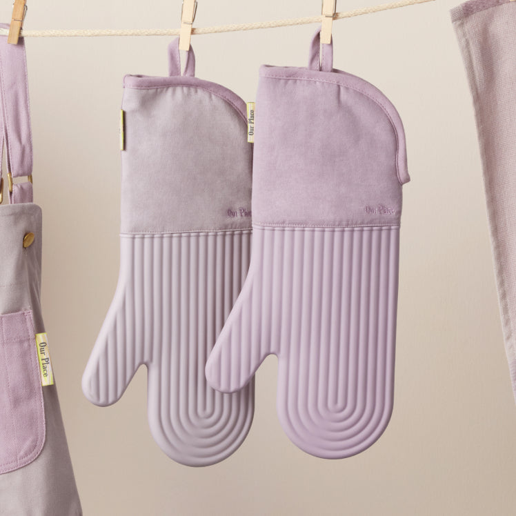 Purple Hot Mitts hanging on a clothesline