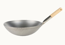 Silver wok with a wooden handle on a white background